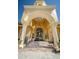 Elegant building entrance with arched entryway and ornate doors at 2746 Via Tivoli # 132B, Clearwater, FL 33764