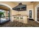 Outdoor kitchen with a built-in grill and bar seating at 2746 Via Tivoli # 132B, Clearwater, FL 33764