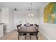Bright dining room with a wooden table and chairs, ideal for Gathering meals at 2746 Via Tivoli # 132B, Clearwater, FL 33764