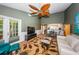 Living room features a comfortable seating area and access to patio at 1377 N Mcmullen Booth Rd # 1377, Clearwater, FL 33759