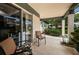 Cozy patio with seating, offering access to the kitchen at 1377 N Mcmullen Booth Rd # 1377, Clearwater, FL 33759