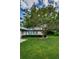 Charming home with lush green lawn and flowering tree at 1377 N Mcmullen Booth Rd # 1377, Clearwater, FL 33759