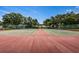 Two tennis courts with red and green surfaces at 1377 N Mcmullen Booth Rd # 1377, Clearwater, FL 33759