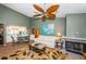 Spacious living room with a white sofa and ceiling fan, open to dining area at 1377 N Mcmullen Booth Rd # 1377, Clearwater, FL 33759
