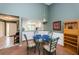 Charming dining area with glass table and four chairs, adjacent to the kitchen at 1377 N Mcmullen Booth Rd # 1377, Clearwater, FL 33759