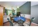 Open concept dining area with glass table and chairs, overlooks living room at 1377 N Mcmullen Booth Rd # 1377, Clearwater, FL 33759