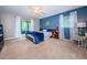 Spacious bedroom with a comfortable bed and access to a private balcony at 1377 N Mcmullen Booth Rd # 1377, Clearwater, FL 33759