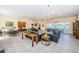 Community room offering ample seating and dining areas with large windows at 1377 N Mcmullen Booth Rd # 1377, Clearwater, FL 33759