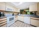 Efficient kitchen with white appliances and ample counter space at 1377 N Mcmullen Booth Rd # 1377, Clearwater, FL 33759