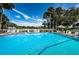 Relax by the refreshing community pool, complete with lounge chairs and a rope at 1377 N Mcmullen Booth Rd # 1377, Clearwater, FL 33759
