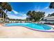 Inviting kidney-shaped community pool with ample deck space for sunbathing at 1377 N Mcmullen Booth Rd # 1377, Clearwater, FL 33759