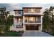 Two-story modern home with attached garage and balcony at 1735 Massachusetts Ne Ave, St Petersburg, FL 33703