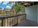 Deck with wooden railings and peaceful water views at 200 Meres Blvd # 11, Tarpon Springs, FL 34689