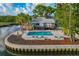 Community pool with lounge chairs, and a waterfront view at 200 Meres Blvd # 11, Tarpon Springs, FL 34689