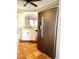 Kitchen with stainless steel refrigerator and tile floors at 7267 Teaberry St, Englewood, FL 34224
