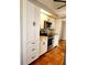 Modern kitchen with stainless steel appliances and white cabinets at 7267 Teaberry St, Englewood, FL 34224