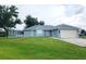 Charming house with attached garage and large yard at 7267 Teaberry St, Englewood, FL 34224