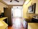 Open concept kitchen with stainless steel appliances at 7267 Teaberry St, Englewood, FL 34224