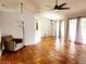 Spacious living room featuring tile floors and a ceiling fan at 7267 Teaberry St, Englewood, FL 34224
