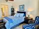 Serene bedroom with a king-size bed and blue accents at 1460 Gulf Blvd # 1212, Clearwater Beach, FL 33767