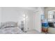 Small bedroom with floral bedding and a closet at 1847 Shore S Dr # 202, South Pasadena, FL 33707