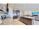 Modern kitchen with granite countertops and stainless steel appliances at 30964 Penny Surf Loop, Wesley Chapel, FL 33545