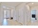 Bright and spacious entryway with tile flooring and ample closet space at 30964 Penny Surf Loop, Wesley Chapel, FL 33545