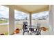 Covered patio with outdoor seating and grill at 30964 Penny Surf Loop, Wesley Chapel, FL 33545