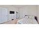 Bedroom with a double bed, dresser, and mounted TV at 30964 Penny Surf Loop, Wesley Chapel, FL 33545