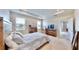 Spacious bedroom with a comfortable bed and access to a patio at 30964 Penny Surf Loop, Wesley Chapel, FL 33545
