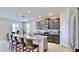 Modern kitchen with granite countertops and dark brown cabinets at 30964 Penny Surf Loop, Wesley Chapel, FL 33545