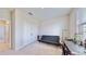Cozy bedroom with a comfortable sofa bed, workspace, and built-in shelving at 30964 Penny Surf Loop, Wesley Chapel, FL 33545
