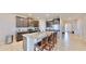 Modern kitchen with granite countertops and breakfast bar at 30964 Penny Surf Loop, Wesley Chapel, FL 33545