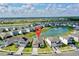 Community view showing home location near lake at 30964 Penny Surf Loop, Wesley Chapel, FL 33545
