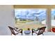Private patio with seating area and lake views at 30964 Penny Surf Loop, Wesley Chapel, FL 33545