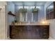 Elegant bathroom with double vanity and large mirrors at 331 Cleveland St # 317, Clearwater, FL 33755