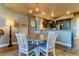 Modern dining room with kitchen access and stylish light fixture at 331 Cleveland St # 317, Clearwater, FL 33755