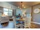 Elegant dining room featuring a round table and modern light fixture at 331 Cleveland St # 317, Clearwater, FL 33755
