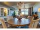 Round dining table with white chairs and built-in hutch at 331 Cleveland St # 317, Clearwater, FL 33755