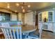 Bright dining area with kitchen views and a modern chandelier at 331 Cleveland St # 317, Clearwater, FL 33755