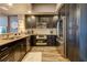 Modern kitchen with stainless steel appliances and dark wood cabinetry at 331 Cleveland St # 317, Clearwater, FL 33755