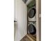 Modern laundry room with stacked washer and dryer at 331 Cleveland St # 317, Clearwater, FL 33755