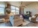 Bright living room with comfy seating, large windows, and a stylish chandelier at 331 Cleveland St # 317, Clearwater, FL 33755