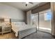Spacious bedroom with private balcony access and a king-size bed at 331 Cleveland St # 317, Clearwater, FL 33755
