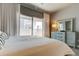Main bedroom with private balcony access and modern dresser at 331 Cleveland St # 317, Clearwater, FL 33755