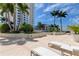 Relaxing patio area with lounge chairs and tropical landscaping at 331 Cleveland St # 317, Clearwater, FL 33755