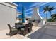 Outdoor patio with grill, table, and umbrella at 331 Cleveland St # 317, Clearwater, FL 33755