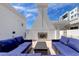 Relaxing patio area with a fireplace and seating at 331 Cleveland St # 317, Clearwater, FL 33755