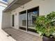 Private patio with sliding glass doors and potted plant at 331 Cleveland St # 317, Clearwater, FL 33755