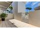 Private patio with gate access and potted plant at 331 Cleveland St # 317, Clearwater, FL 33755